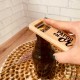 Décapsuleur en bois papou en or